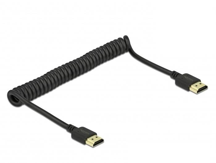 Černý, spirálovitý HDMI kabel s konektorem na každém konci, vhodný pro audiovizuální připojení v technických zařízeních.