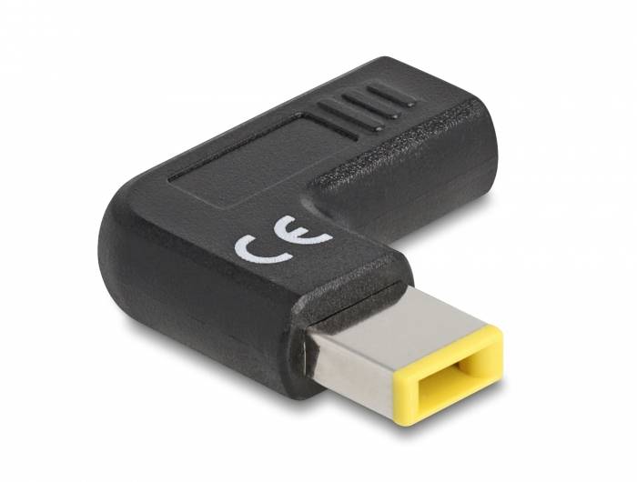 USB adaptér s žlutým a černým designem, označený značkou 'CE', která indikuje jeho shodu s evropskými normami.