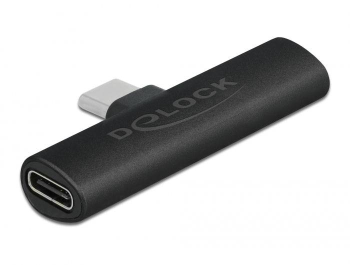 Adaptér s konektorem USB-C na USB-C, černý obdélníkový design s logem 'Delock' zobrazeným po straně.