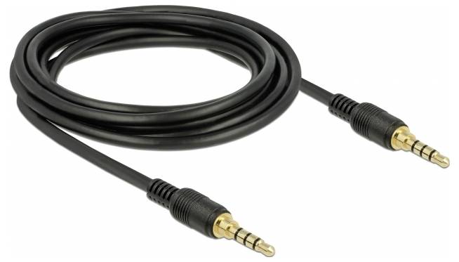 Černý audiokabel se dvěma zlatými 3,5mm jack konektory na koncích, navinutý na světlém pozadí.