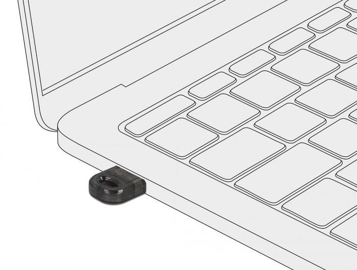 Malý USB flash disk je připojen k laptopu, částečně zasunutý do USB portu. Laptop je zobrazen v obrysu.