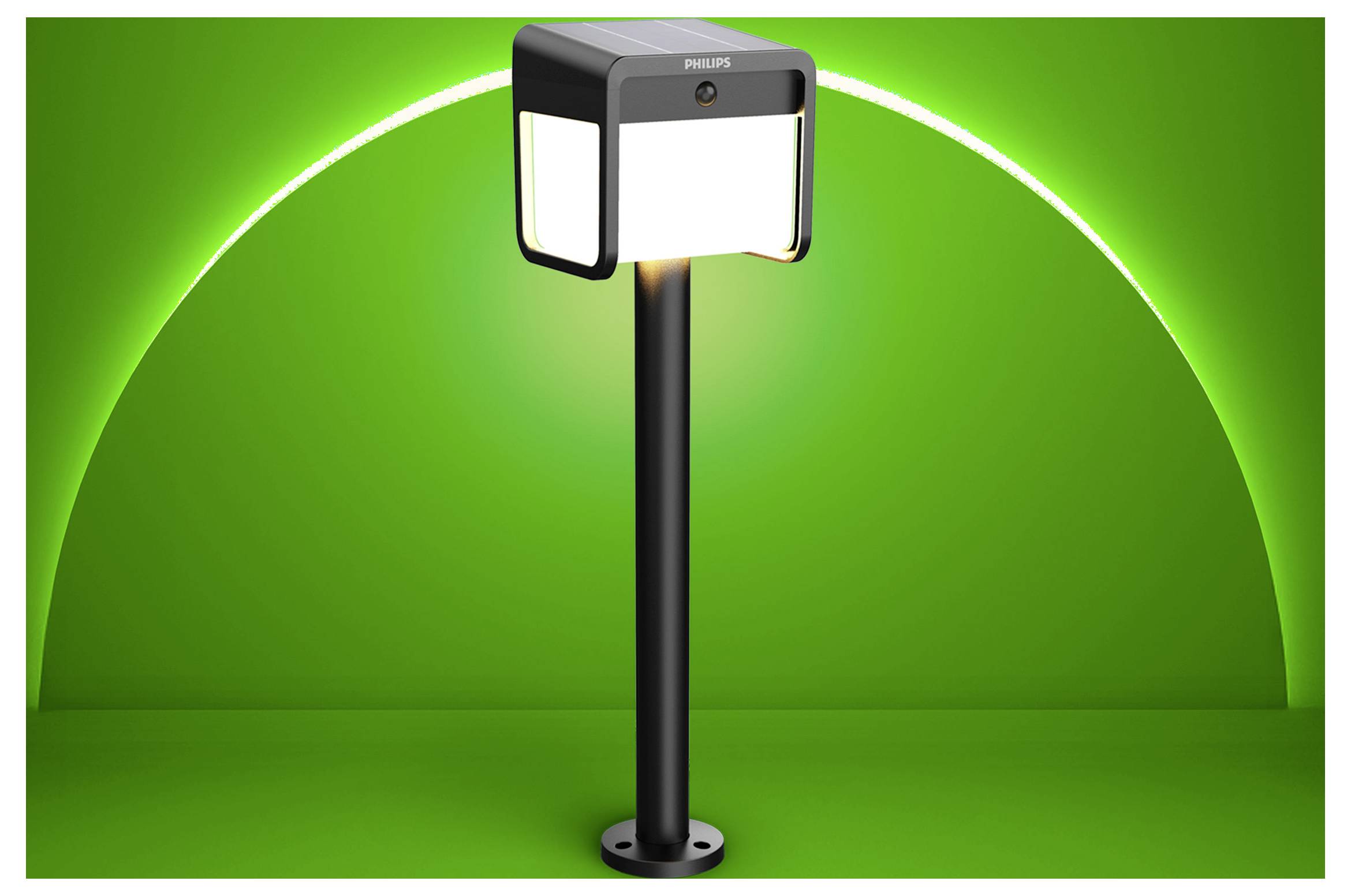 Černý venkovní osvětlovací sloup Philips se čtvercovými osvětlenými panely na vysokém sloupu před zeleným pozadím.