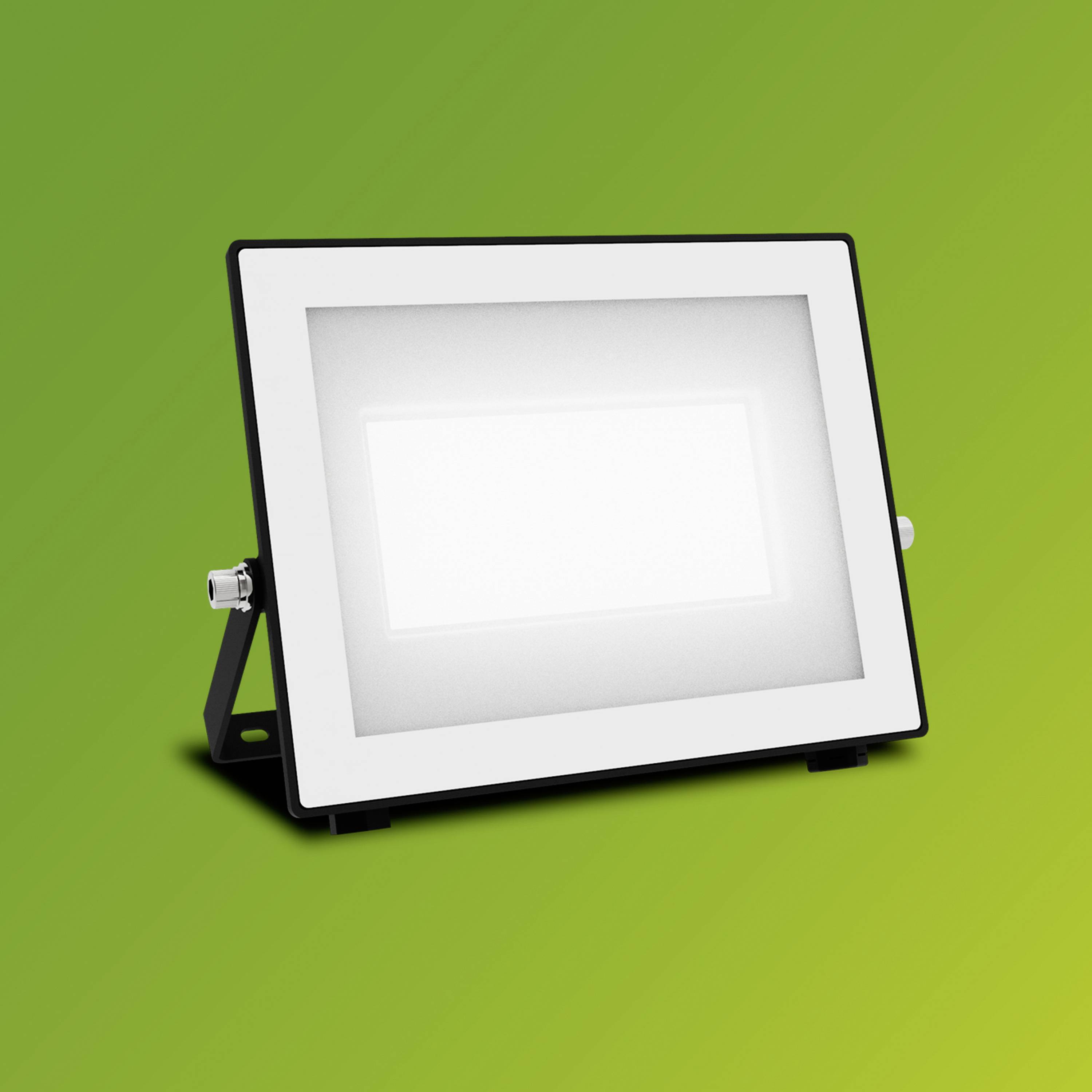 LED reflektor s obdélníkovým rámem před zeleným pozadím.