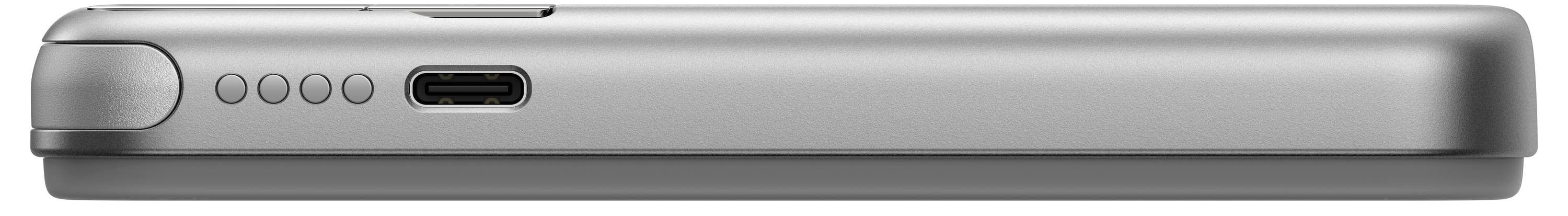 Stříbrné, ploché zařízení ze strany s USB-C konektorem a čtyřmi kulatými tlačítky vedle něj.