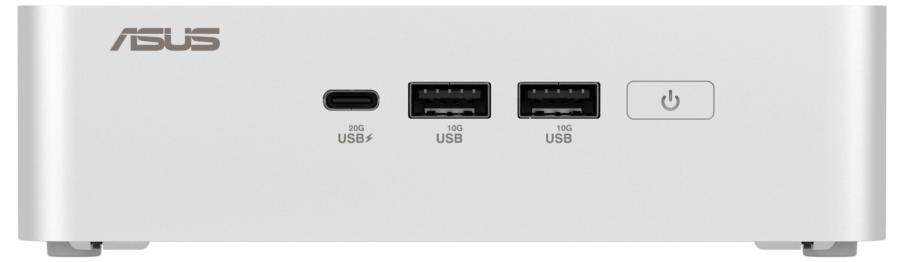Bílý mini počítač s logem 'ASUS' na levé straně. Na přední straně jsou USB porty, USB-C port a síťový vypínač.