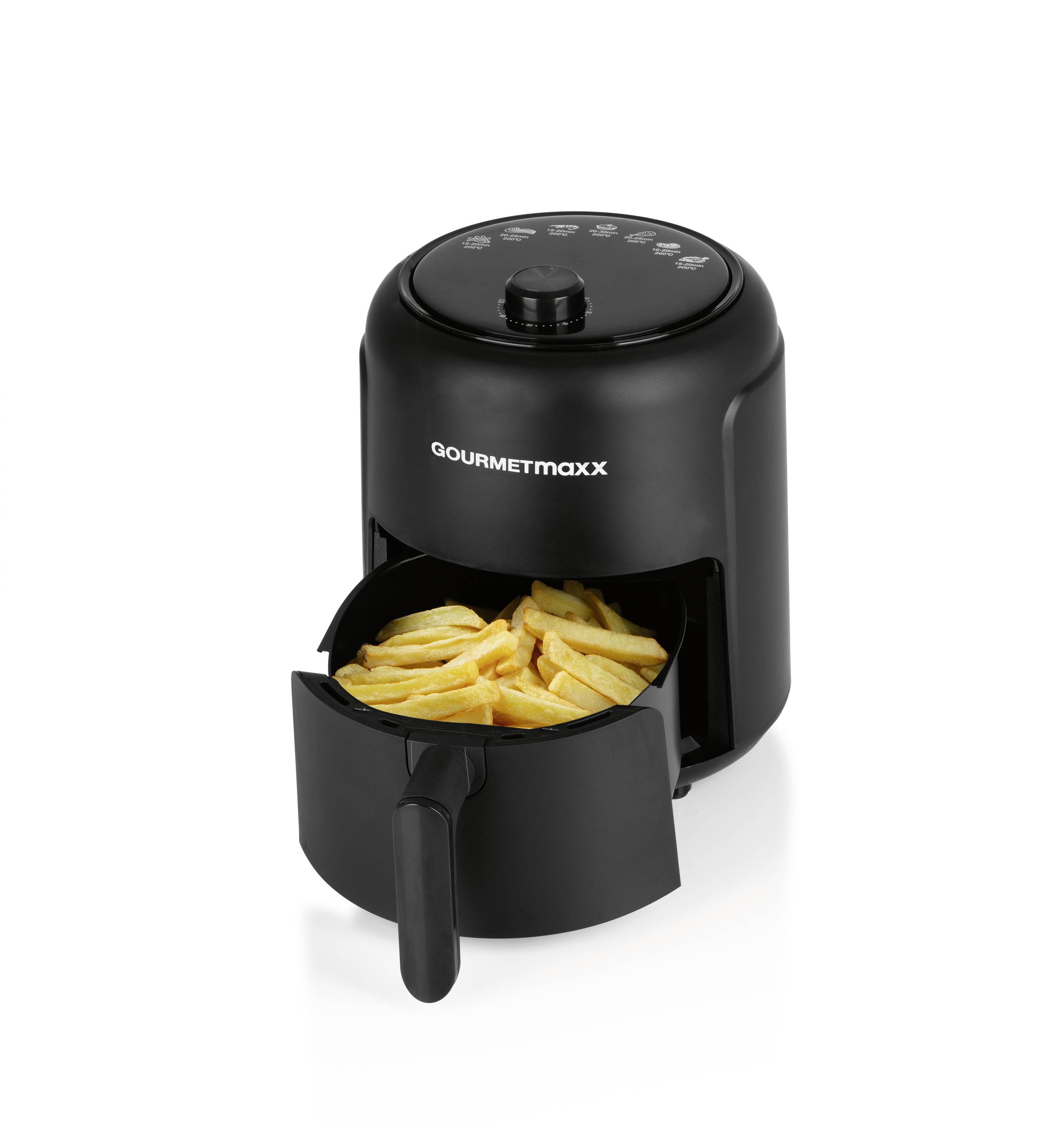 Černá horkovzdušná fritéza s otevřenou zásuvkou, naplněná hranolkami. Navržená pro smažení s nízkým obsahem tuku.