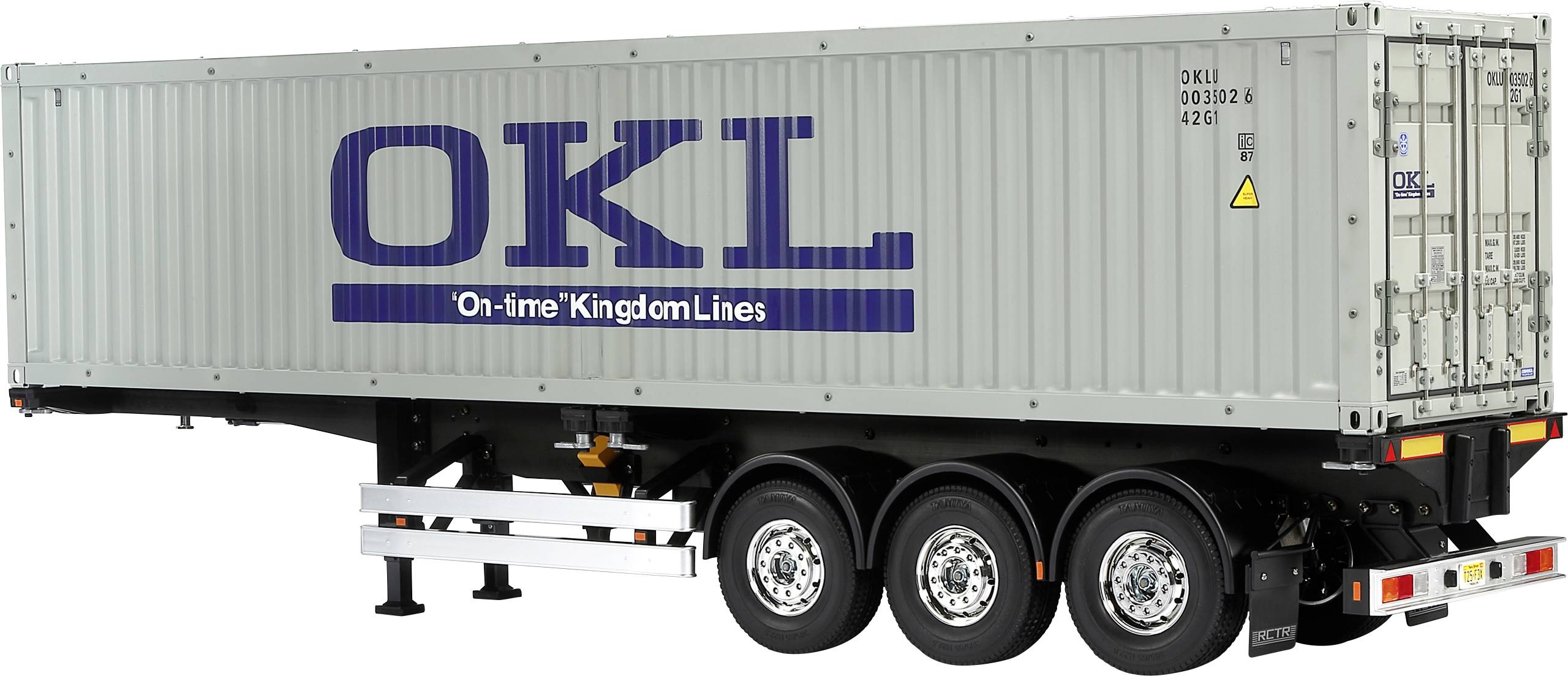 Šedý kontejner nákladního vozidla společnosti 'OKL' s nápisem 'On-time Kingdom Lines' stojí na přívěsu se třemi nápravami.