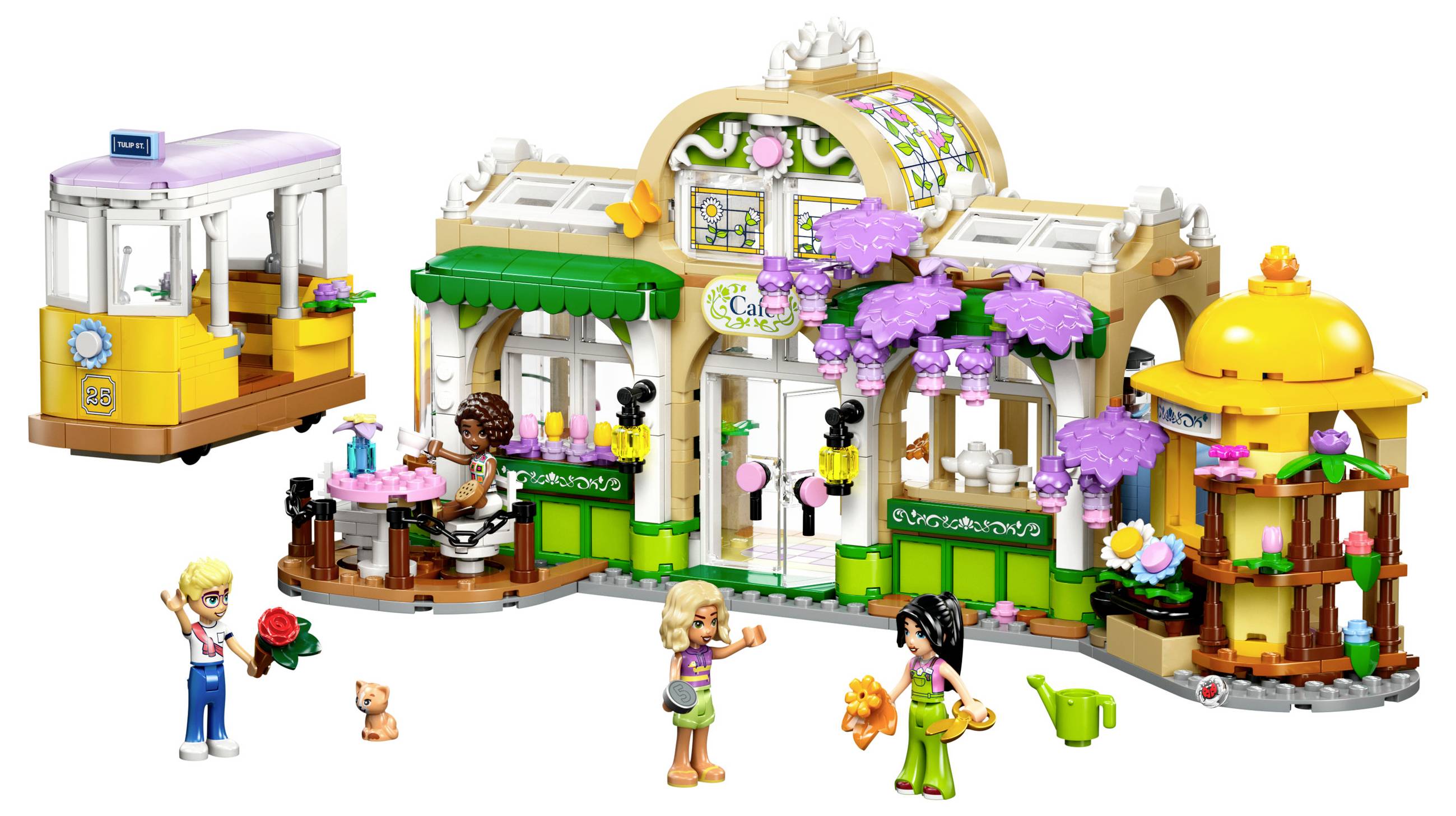 Lego-Café-Set s figurkami, které se setkávají v parku. Před kavárnou si hrají dvě děti s panenkou a medvídkem, vedle sedí někdo u stolu.