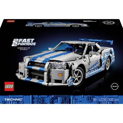 Lego model Nissanu Skyline GT-R (R34) z filmu '2 Fast 2 Furious', s modrým a stříbrným lakováním, na černém pozadí.