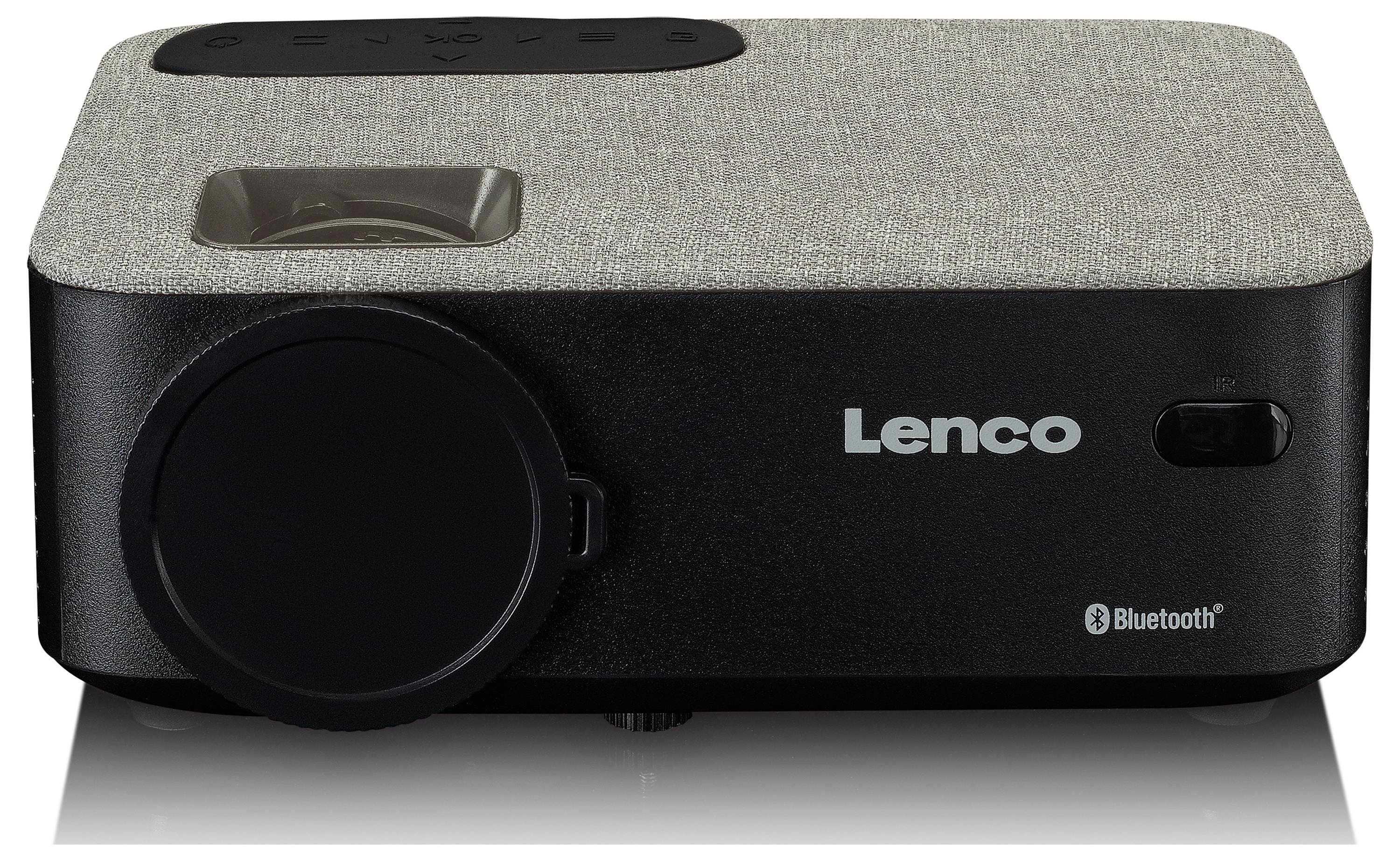 Šedý projektor Lenco s černým okrajem a logem Bluetooth. Vlevo se nachází projekční čočka, vpravo logo Lenco.