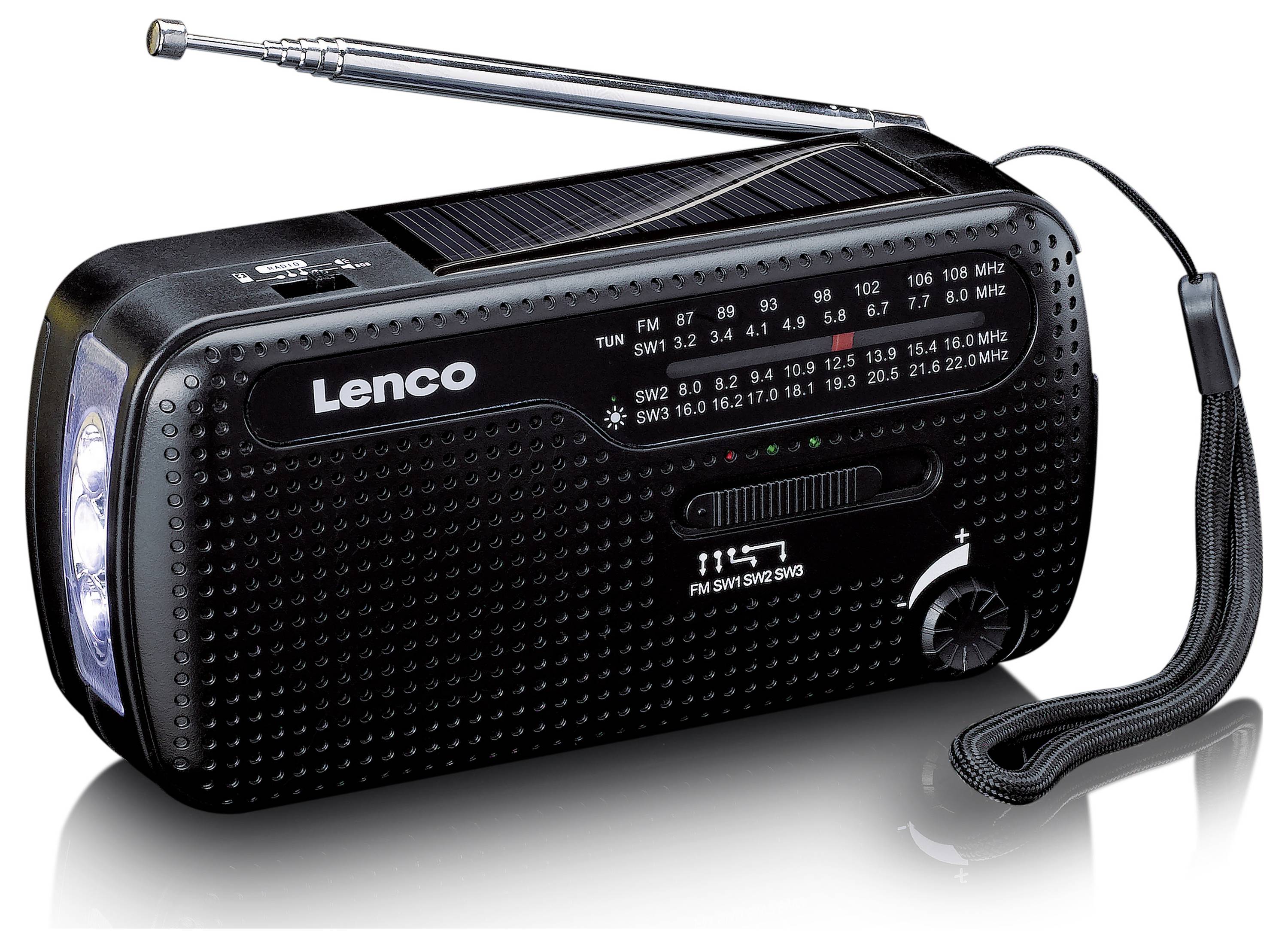 Přenosné rádio s klikou, solárním panelem a baterkou. Frekvence a ovládací prvky jsou viditelné. Páska na zápěstí a vysouvací anténa nahoře.