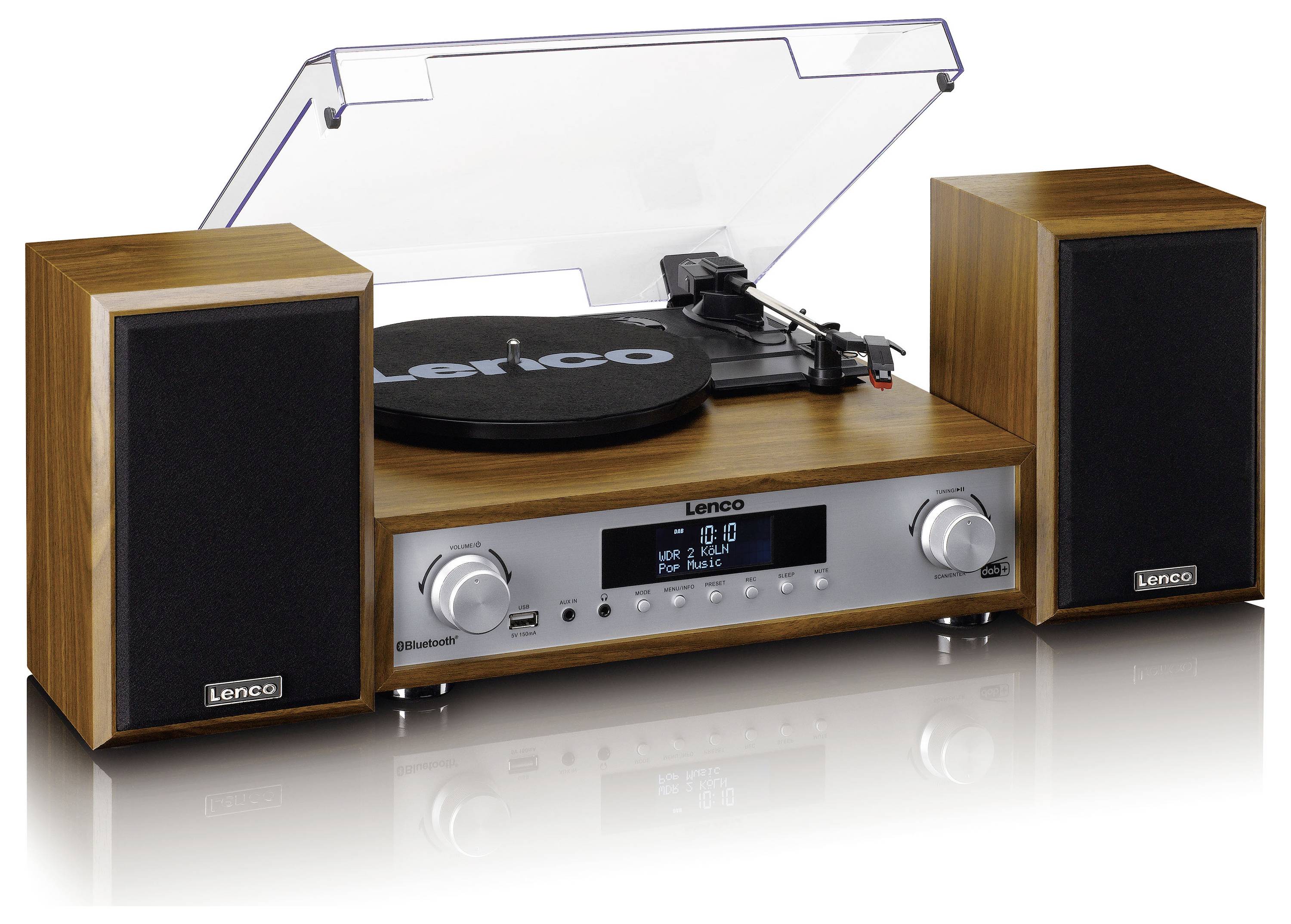 Gramofon se dvěma reproduktory v dřevěném designu, uprostřed deska na přehrávání, průhledný kryt proti prachu. Audio displej vpředu.
