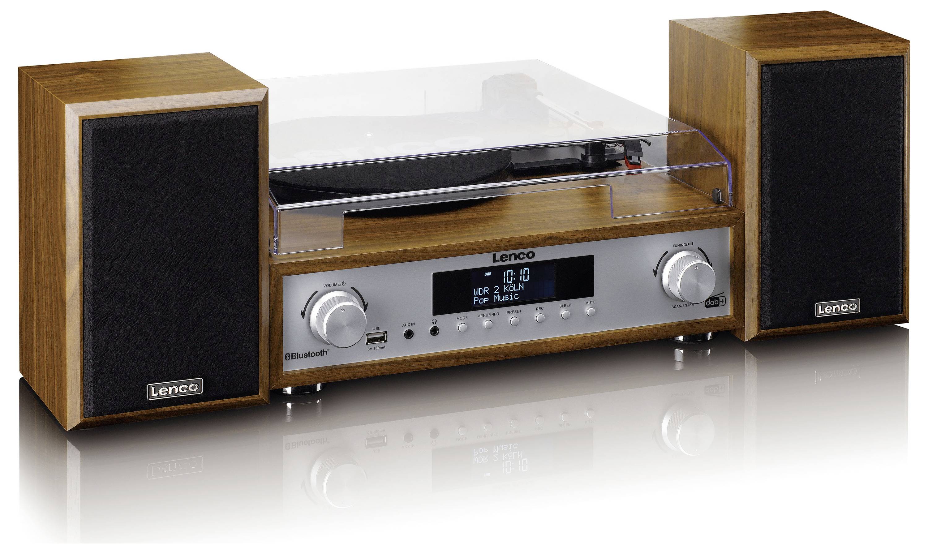 Retro gramofon se dvěma hnědými reproduktory. Zařízení má stříbrný ovládací panel s otočnými knoflíky a digitálním displejem.