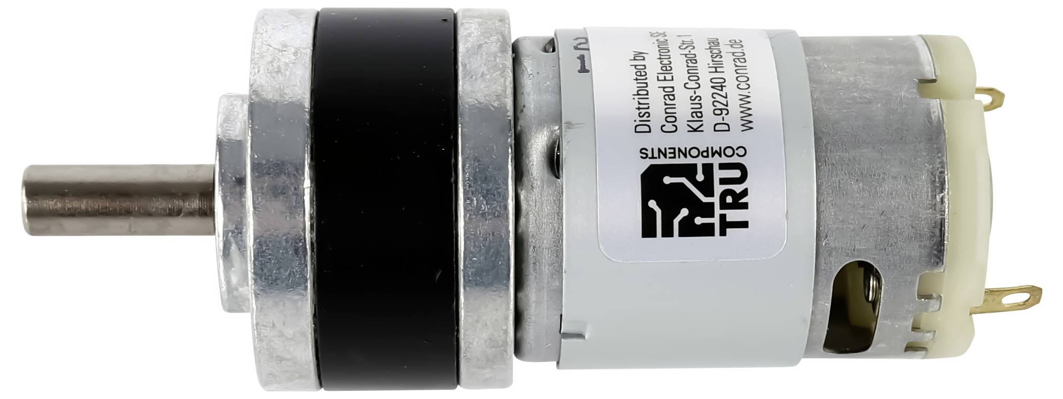 Malý válcový stejnosměrný motor s připojenou převodovkou, skládající se z kovových a plastových komponentů, s nápisem 'TRU Components' na boku.