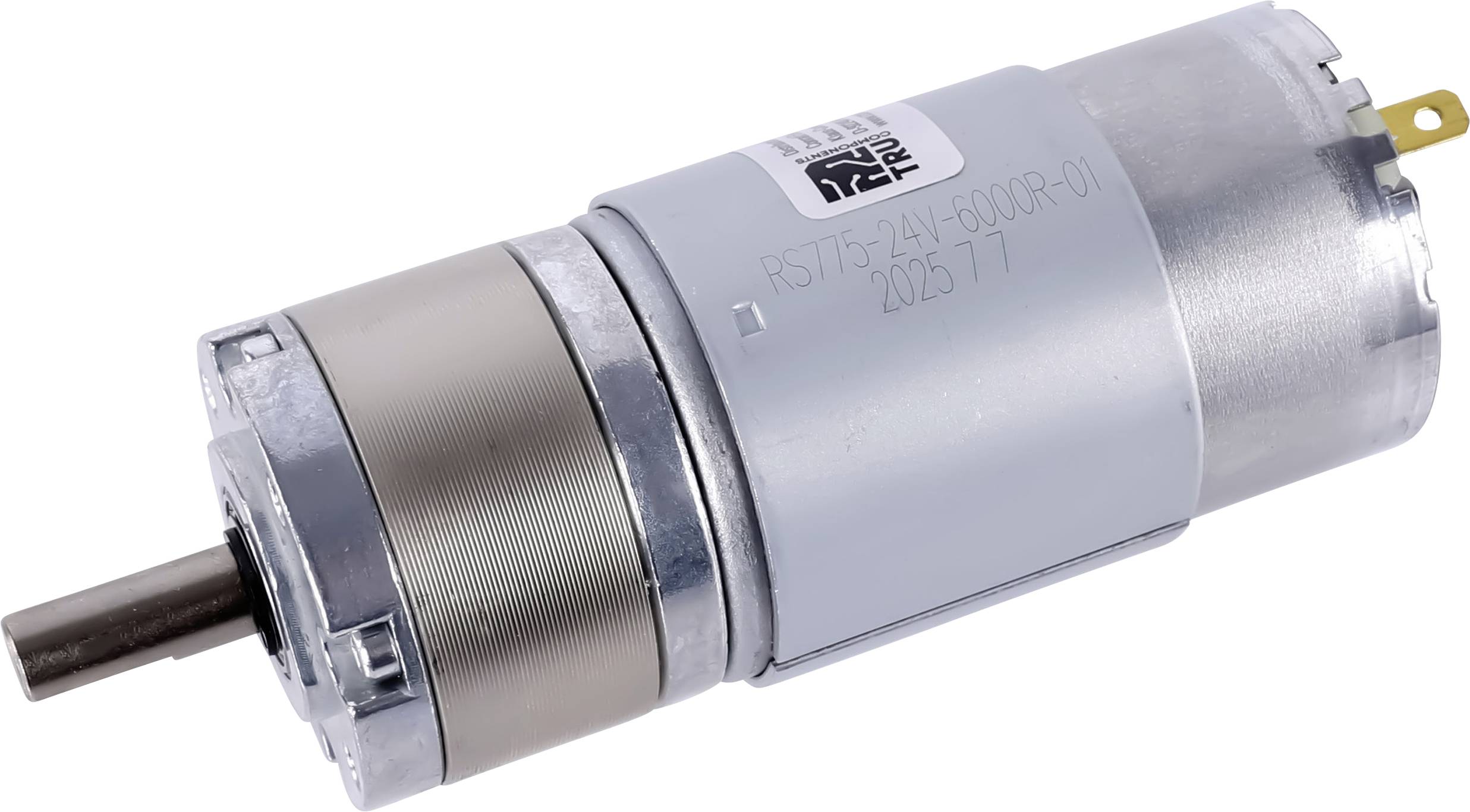 Válcový kovový motorek ozubeného převodu s hřídelí, označený jako RS775-24V-6000RPM-01 202517, umístěný na jednoduchém bílém pozadí.