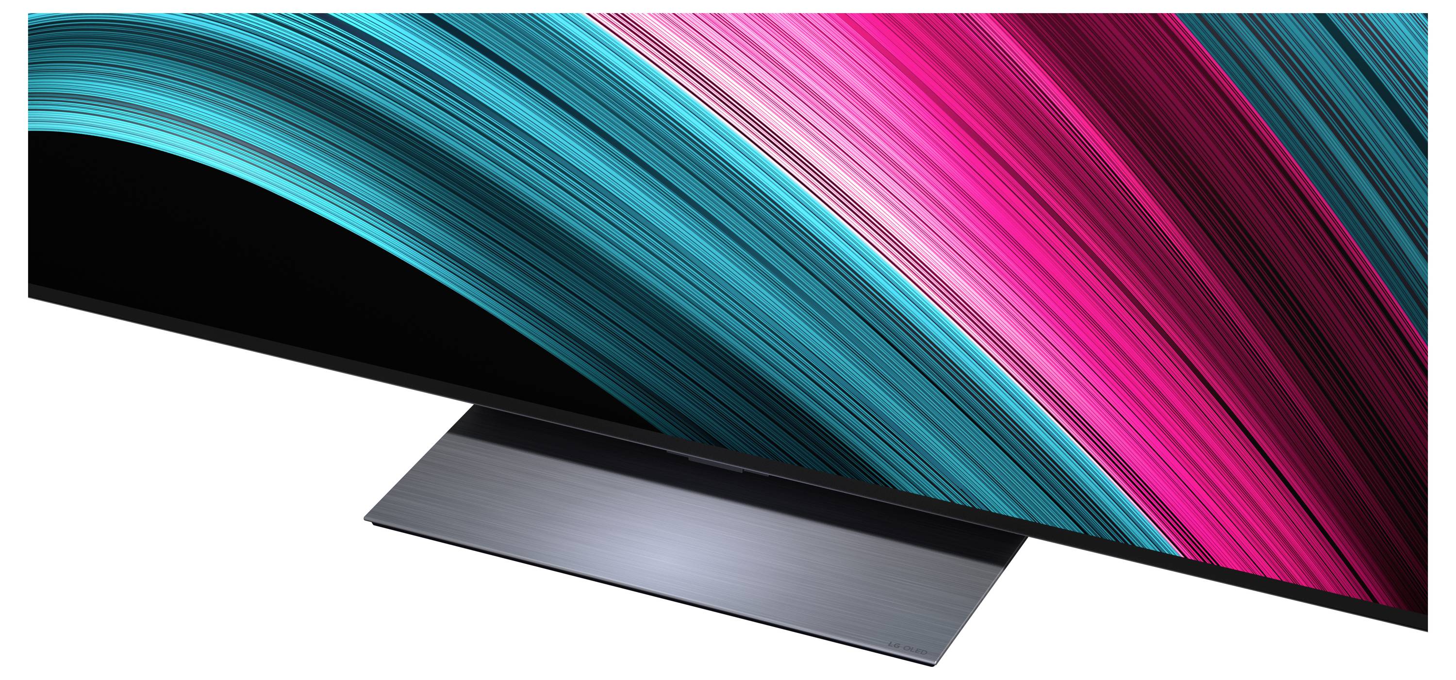 Štíhlá plochá televizní obrazovka zobrazující živé, barevné pruhy v tyrkysové a růžové barvě, umístěná na kovovém stojanu.