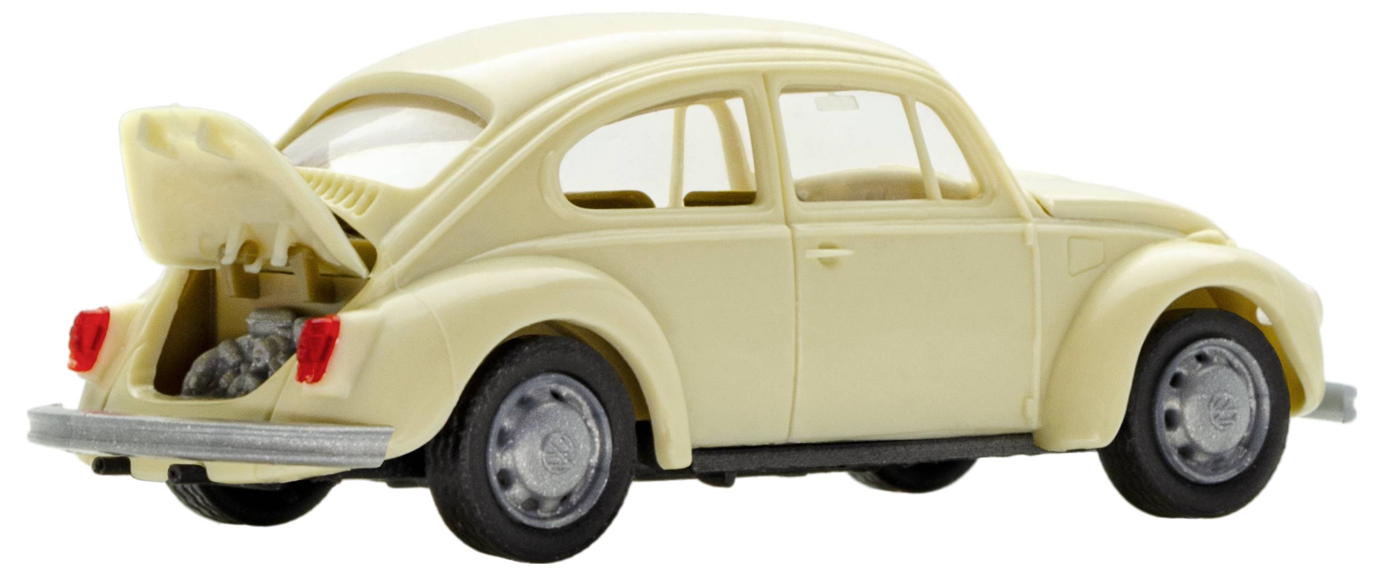 Krémový modelový automobil brouk s otevřeným zavazadlovým prostorem. Zavazadlový prostor vzadu ukazuje malý úložný prostor.