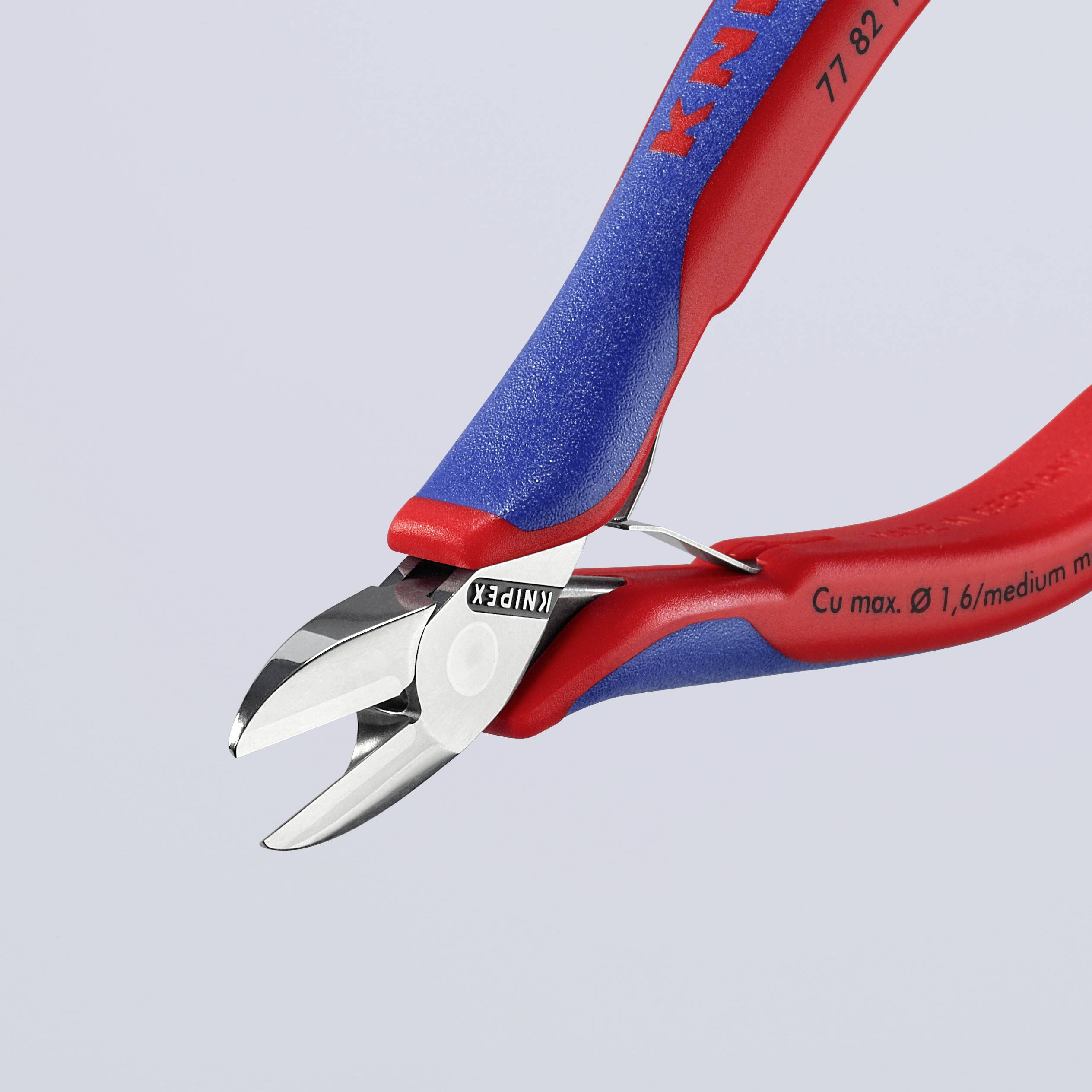 Boční štípací kleště značky Knipex s modro-červenou rukojetí, vhodné pro řezání měděných drátů do průměru 1,6 mm.