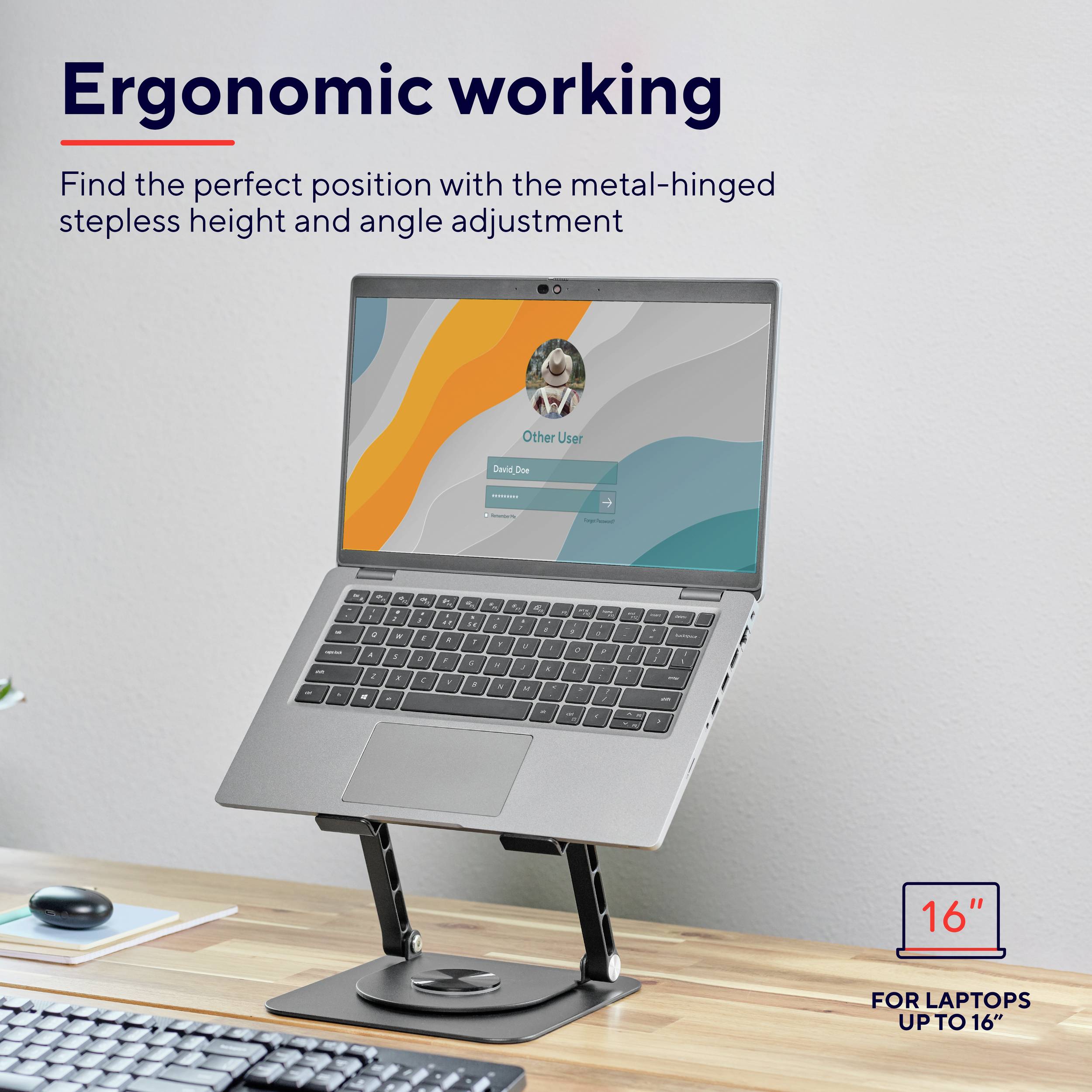 Notebook na nastavitelném stojanu umístěném na psacím stole. Text: 'Ergonomická práce'. Stojan pro notebooky až do 16".