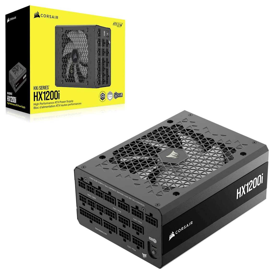 Obrázek ukazuje napájecí zdroj Corsair HX1200i pro počítač s černým tělem a řadou konektorů, umístěný vedle žluté krabice.