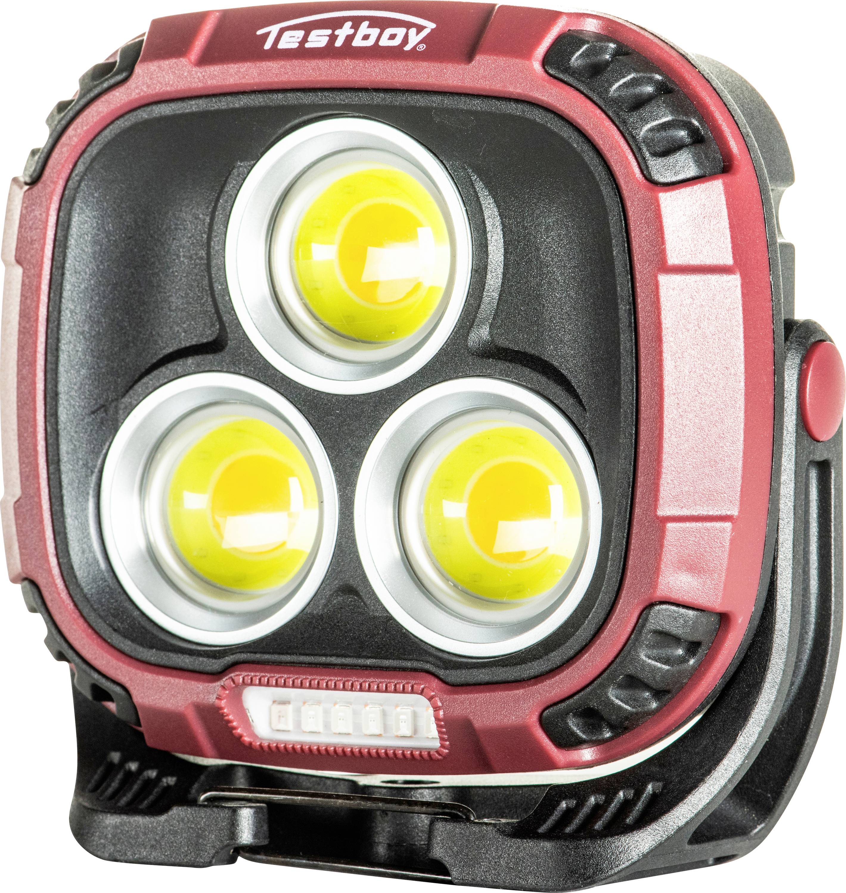Přenosná LED lampa značky 'Testboy' v černo-červeném provedení se třemi žlutými čočkami, vhodná pro použití na staveništích nebo ve venkovním prostředí.