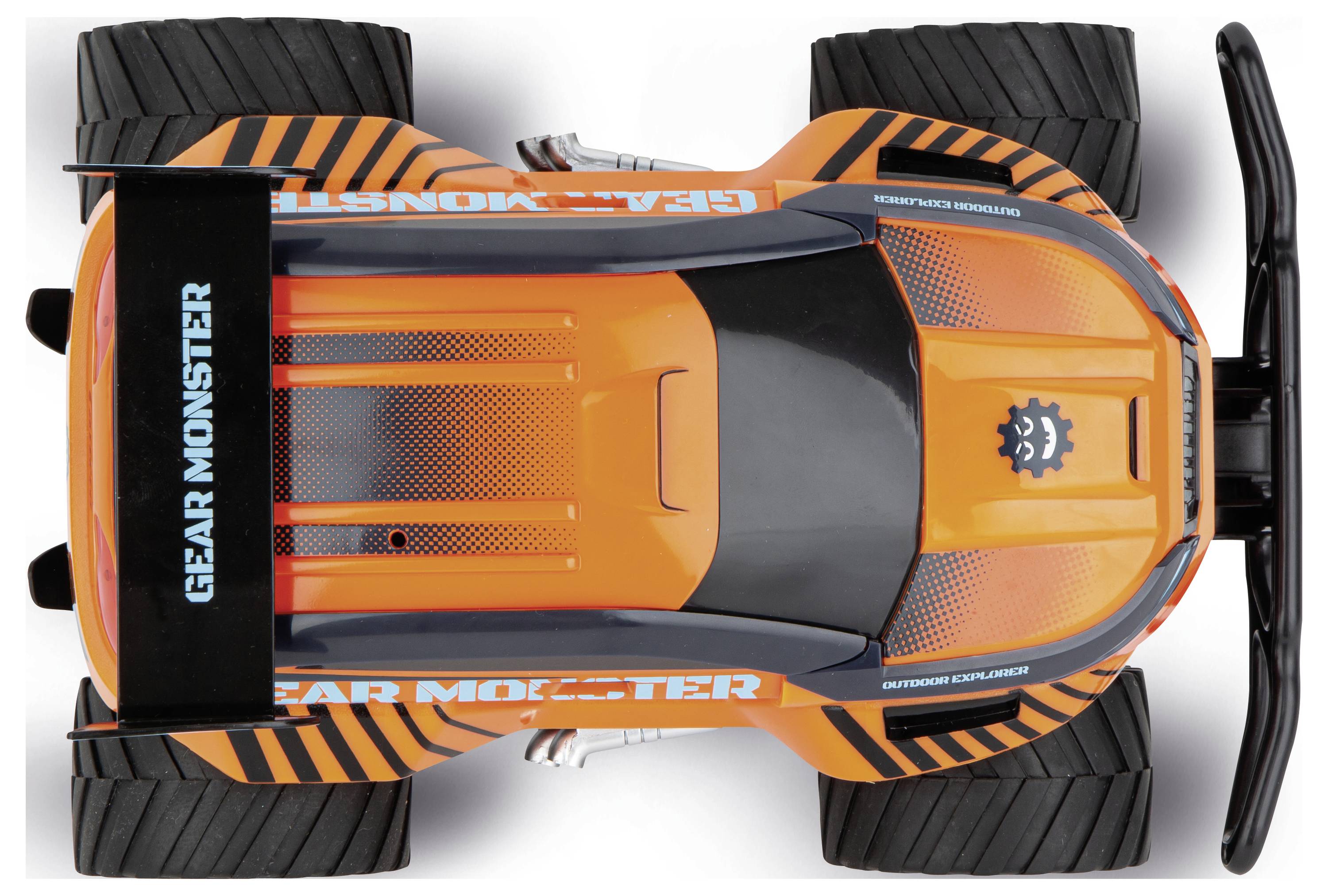 Oranžovo-černé hračkářské auto s nápisem 'GEAR MONSTER' na horní straně. Má velká kola a robustní design.