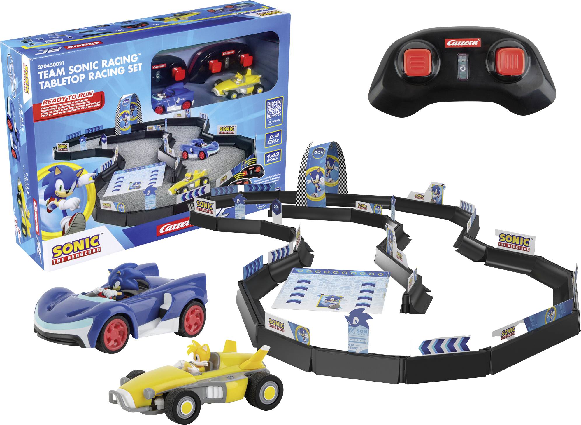 Balíček sady 'Team Sonic Racing' pro stolní závody, který obsahuje dvě malá závodní autíčka a ovladač. Součástí sady je také zakřivená závodní dráha.