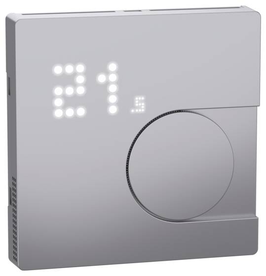 Moderní prostorový termostat zobrazuje teplotu '21'. Design je minimalistický s otočným ovladačem pro nastavení.