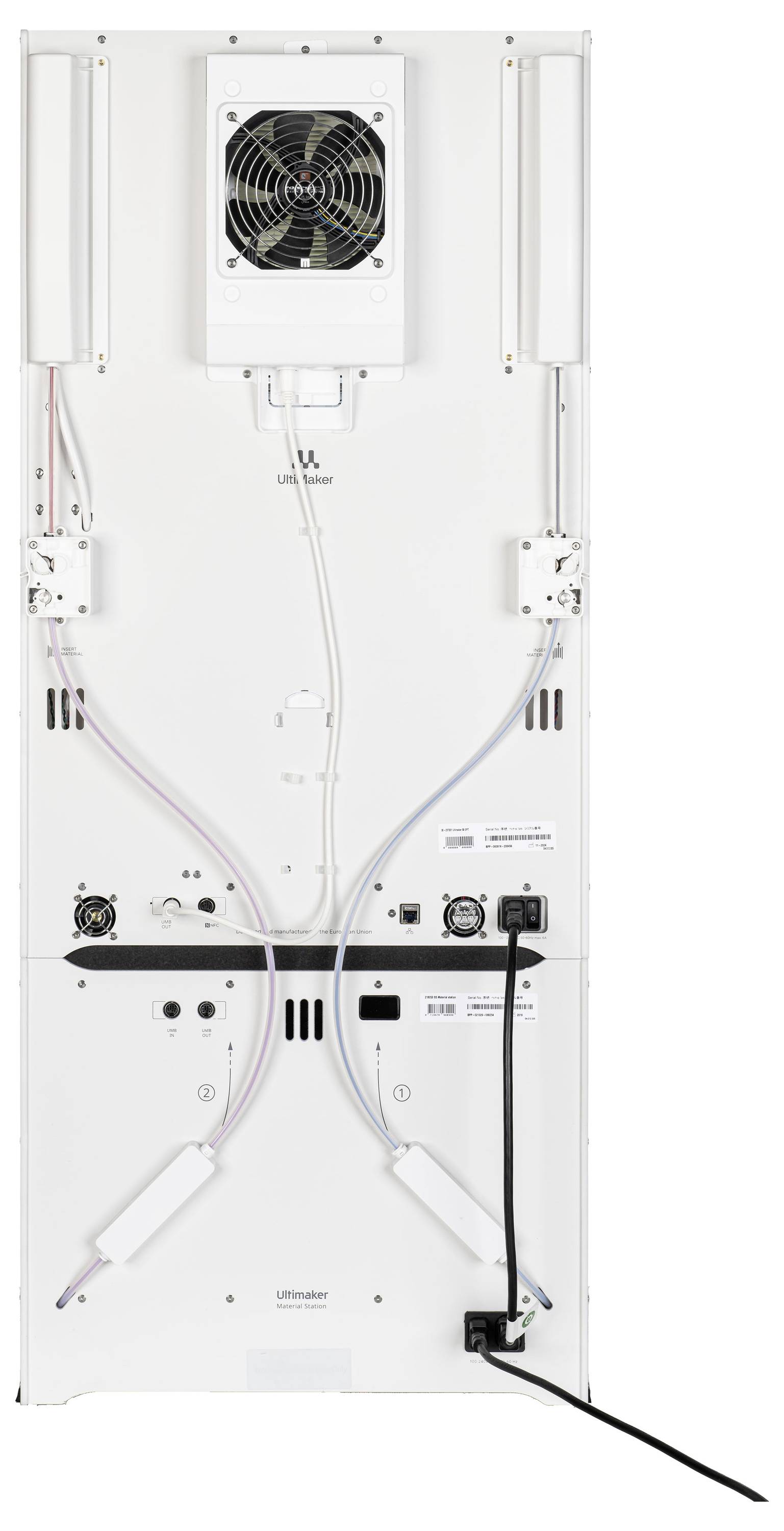 Pohled zezadu na technické zařízení s různými přípojkami a kabely; horní část obsahuje velký ventilátor.