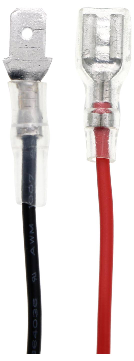 Dva kabely s kovovými konektory: Vlevo černý kabel, vpravo červený kabel. Spojují elektrické komponenty.