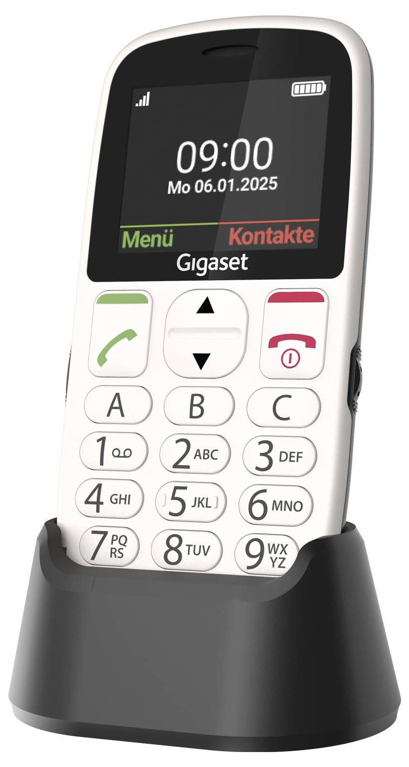 Telefon Gigaset s velkým displejem zobrazuje '09:00 Po 06.01.2025'. Viditelná jsou tlačítka pro přijetí a ukončení hovoru, menu a kontakty. Zařízení stojí v nabíjecí stanici.