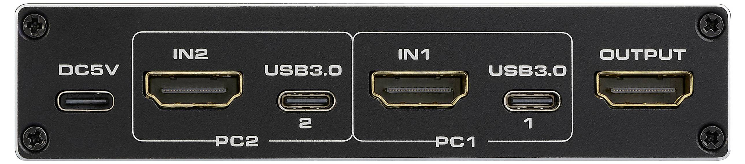 Černé elektronické zařízení s označenými porty: DC5V napájení, dva HDMI vstupy, označené jako 'IN2' a 'IN1', a výstup označený jako 'OUTPUT'.