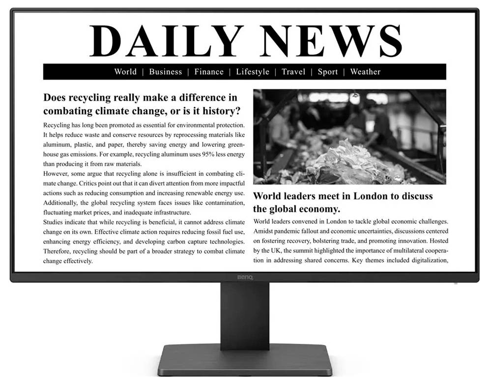 Monitor zobrazuje online noviny s názvem 'Denní zprávy' s články o globálním dopadu recyklace a setkání světových lídrů v Londýně na téma klimatických problémů.