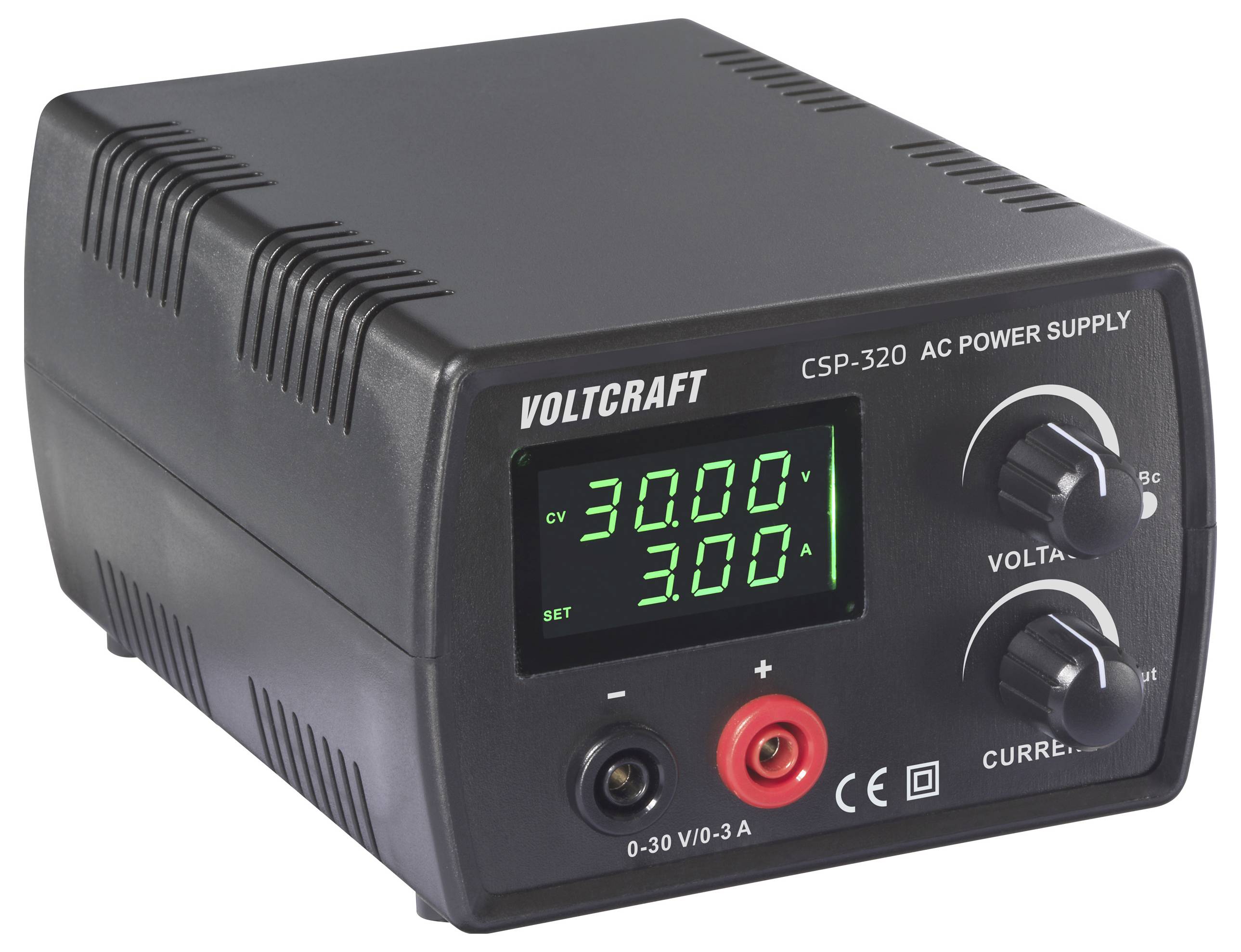 Černý zdroj AC Voltcraft CSP-320 zobrazující na digitální obrazovce '30.00V' a '3.00A' s regulačními prvky pro napětí a proud.
