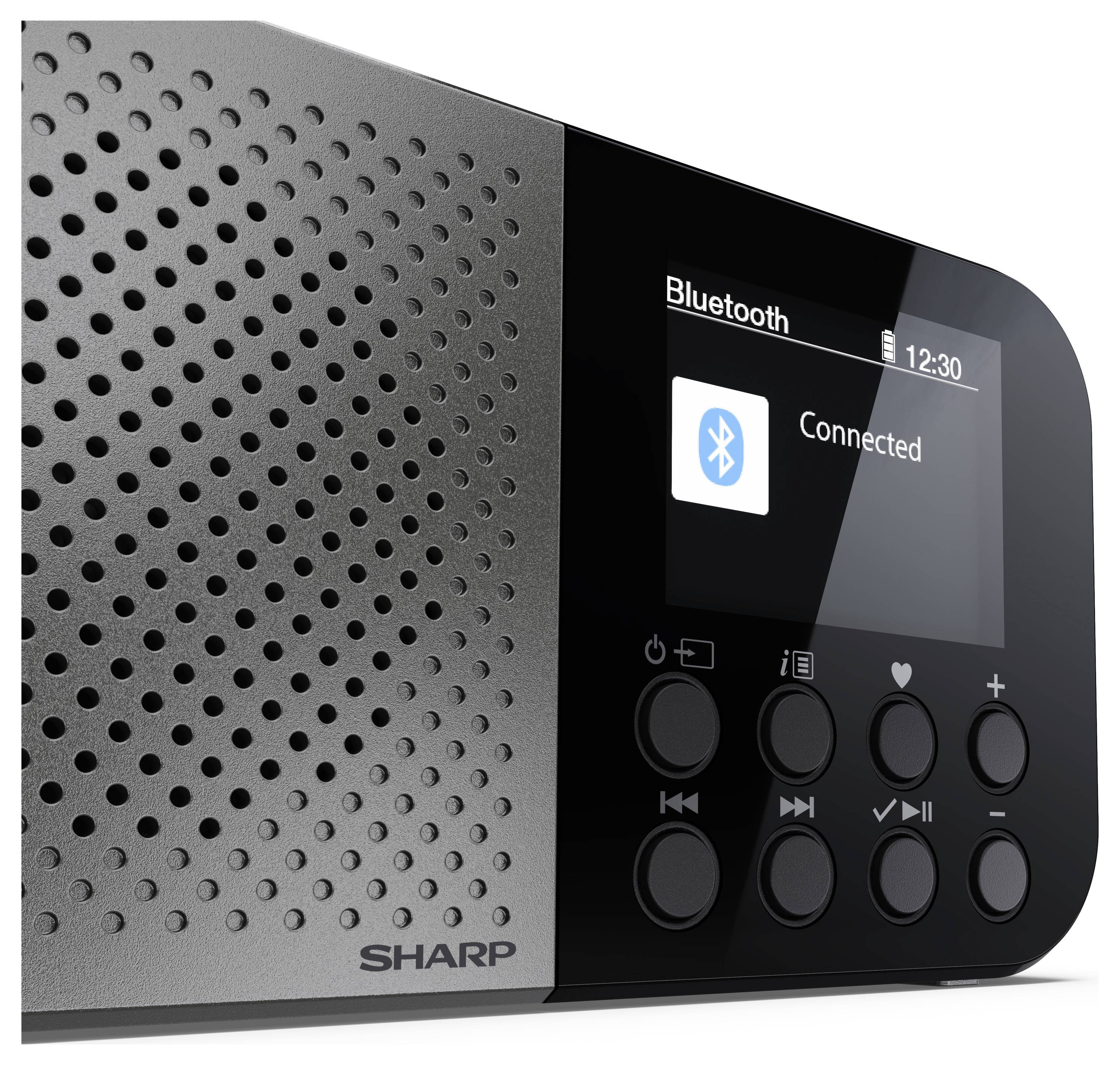 Černý a stříbrný bluetooth reproduktor s digitálním displejem zobrazujícím 'Bluetooth Připojeno' a několika ovládacími tlačítky.