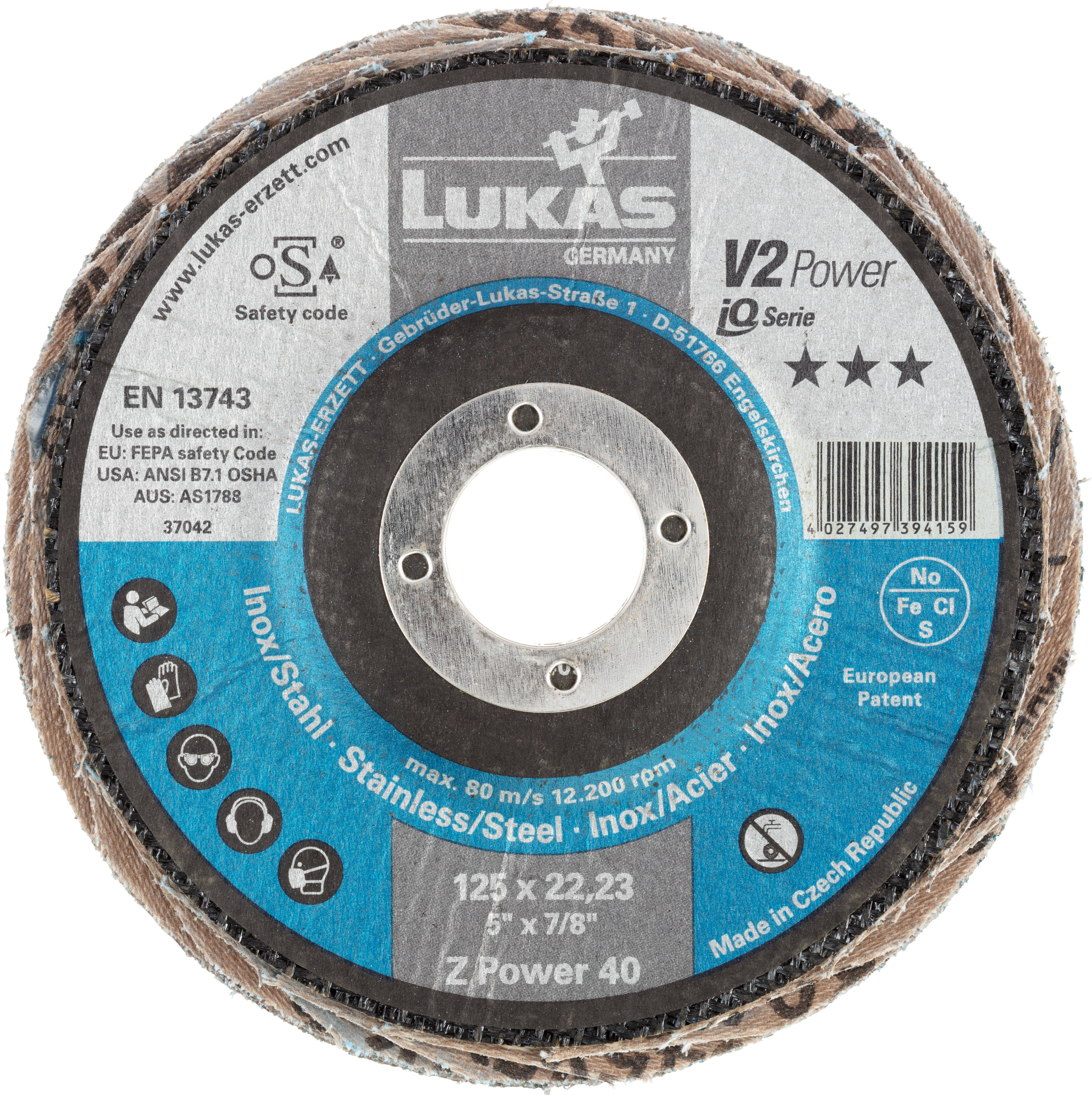 Brusný kotouč označený "Lukas Germany" pro nerezovou ocel, průměr 125 mm, evropský patent. Maximální rychlost 12 200 ot./min.