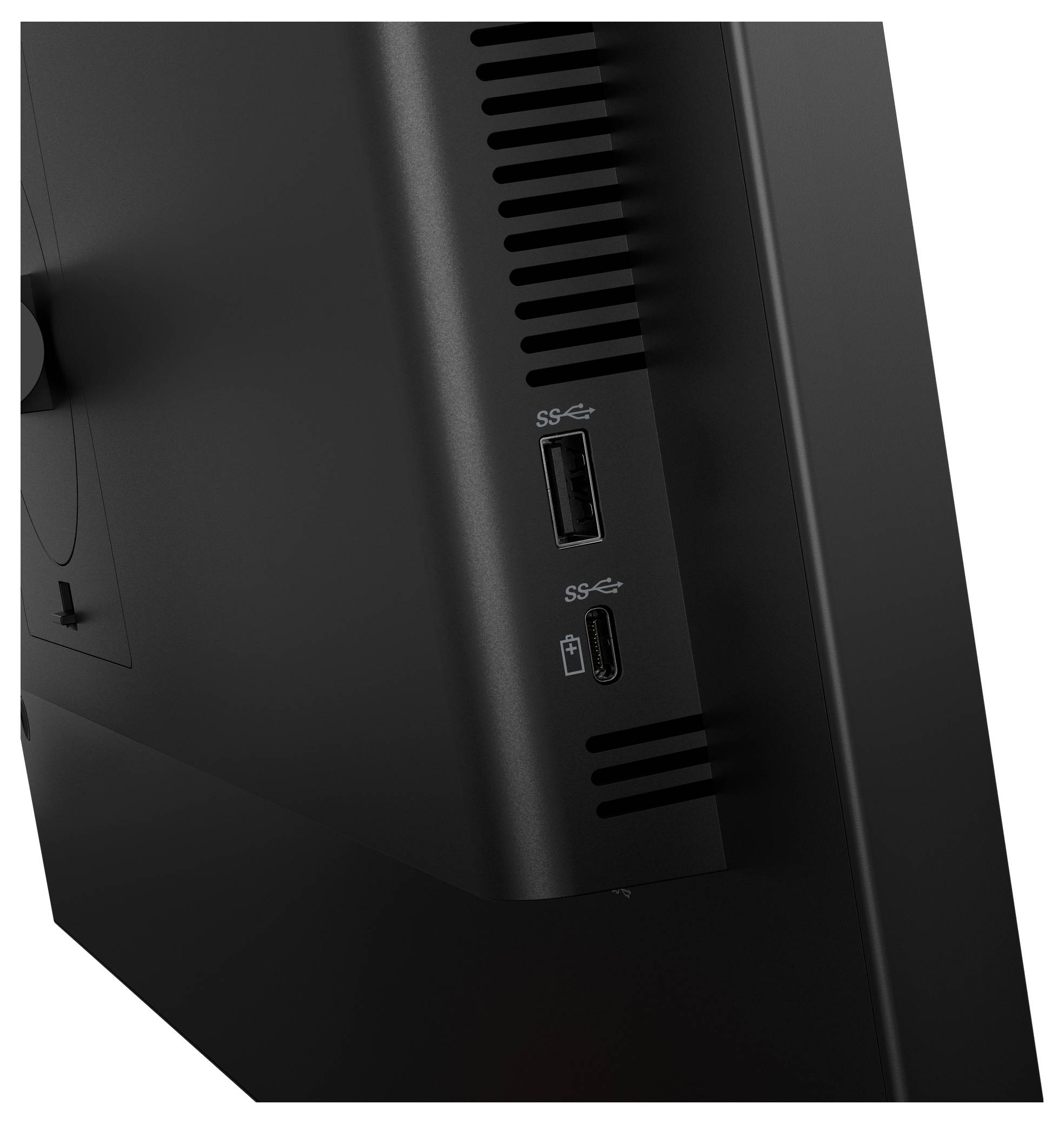 Detailní pohled na zadní stranu černého počítačového monitoru, na kterém jsou vidět dva USB porty označené "SS".