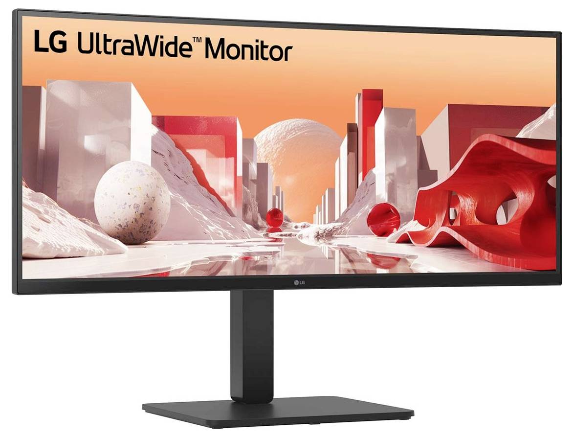 Široký monitor zobrazující futuristickou krajinu s geometrickými tvary a sytými červenými a bílými barvami.
