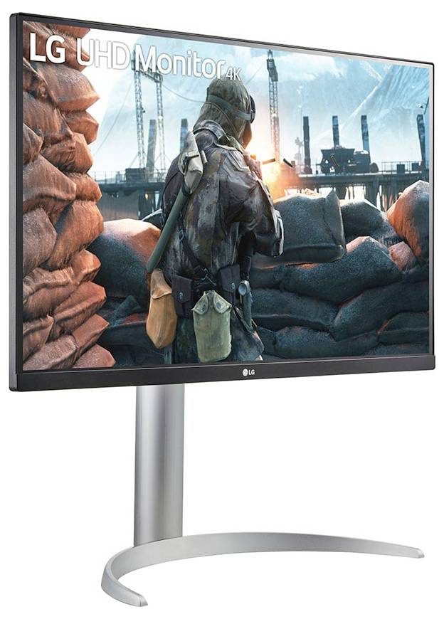 Monitor zobrazující videoher s postavou vojáka, obklopený pytli s pískem, s pozadím staveniště. Text říká 'LG UHD Monitor 4K'.