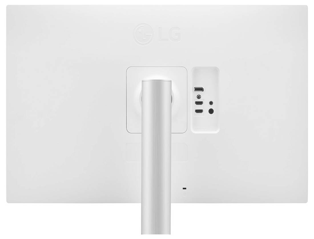 Bílý počítačový monitor z pohledu zezadu, zobrazující porty a stojan, s minimalistickým designem.