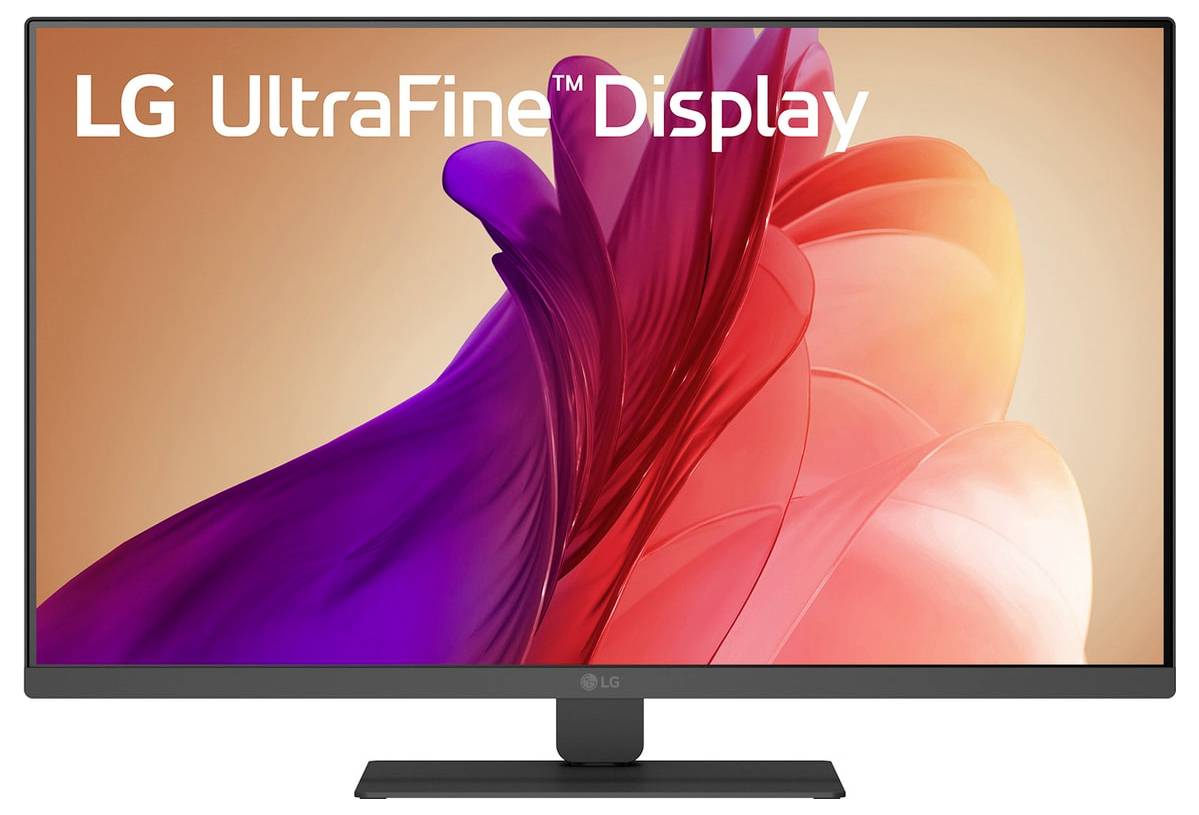 Monitor počítače zobrazující živé červené a fialové abstraktní tvary s textem 'LG UltraFine Display' přes horní část displeje.