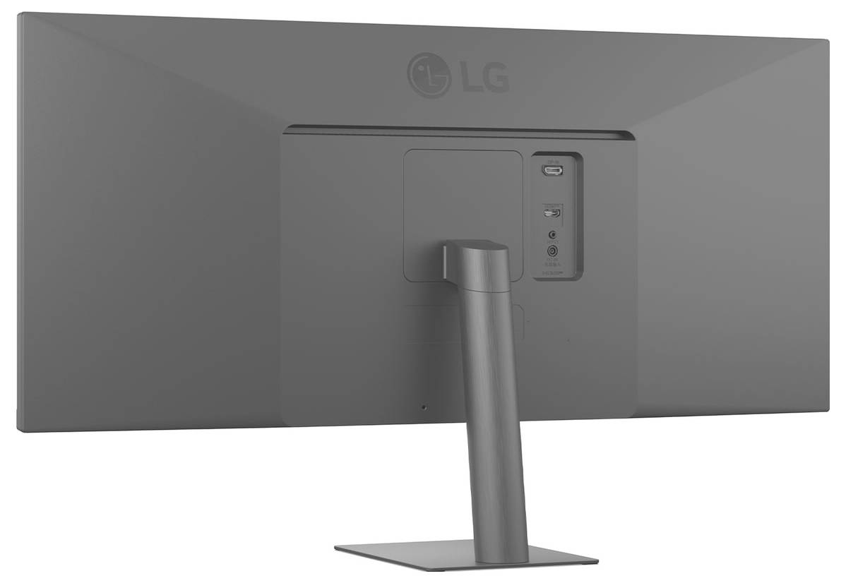 Zadní pohled na šedý počítačový monitor značky LG zobrazující stojan, porty a logo LG.