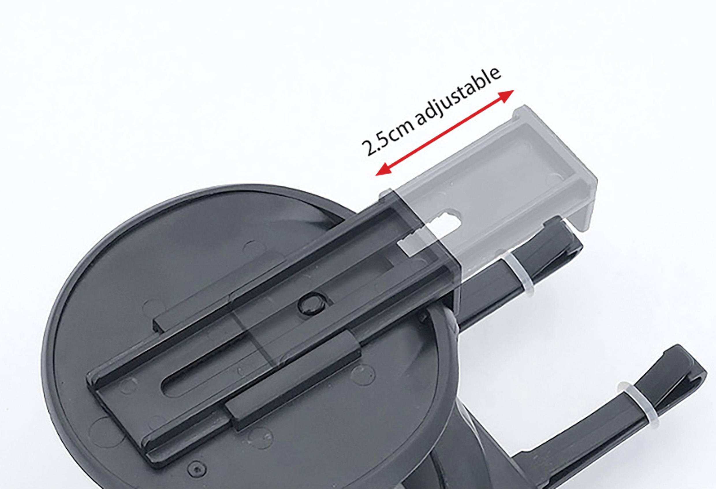 Výškově nastavitelný držák na telefon s kruhovým podstavcem a sloty prouchycení zařízení, umožňující nastavení výšky o 2,5 cm pomocí posuvného mechanismu.