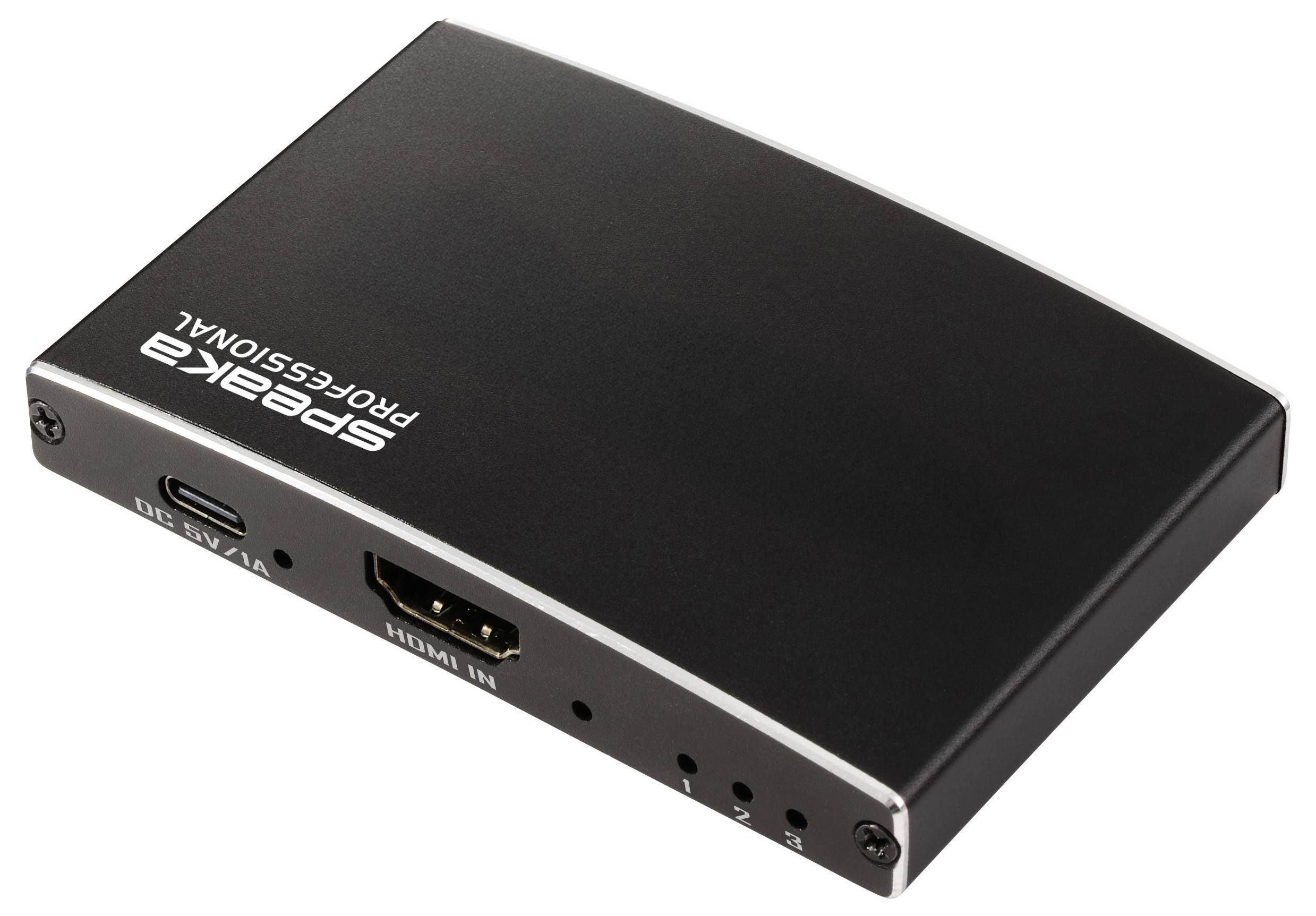 Černý audio přístroj značky Speaka Professional s HDMI a USB porty, používaný pro připojování a zpracování audio nebo video signálů.