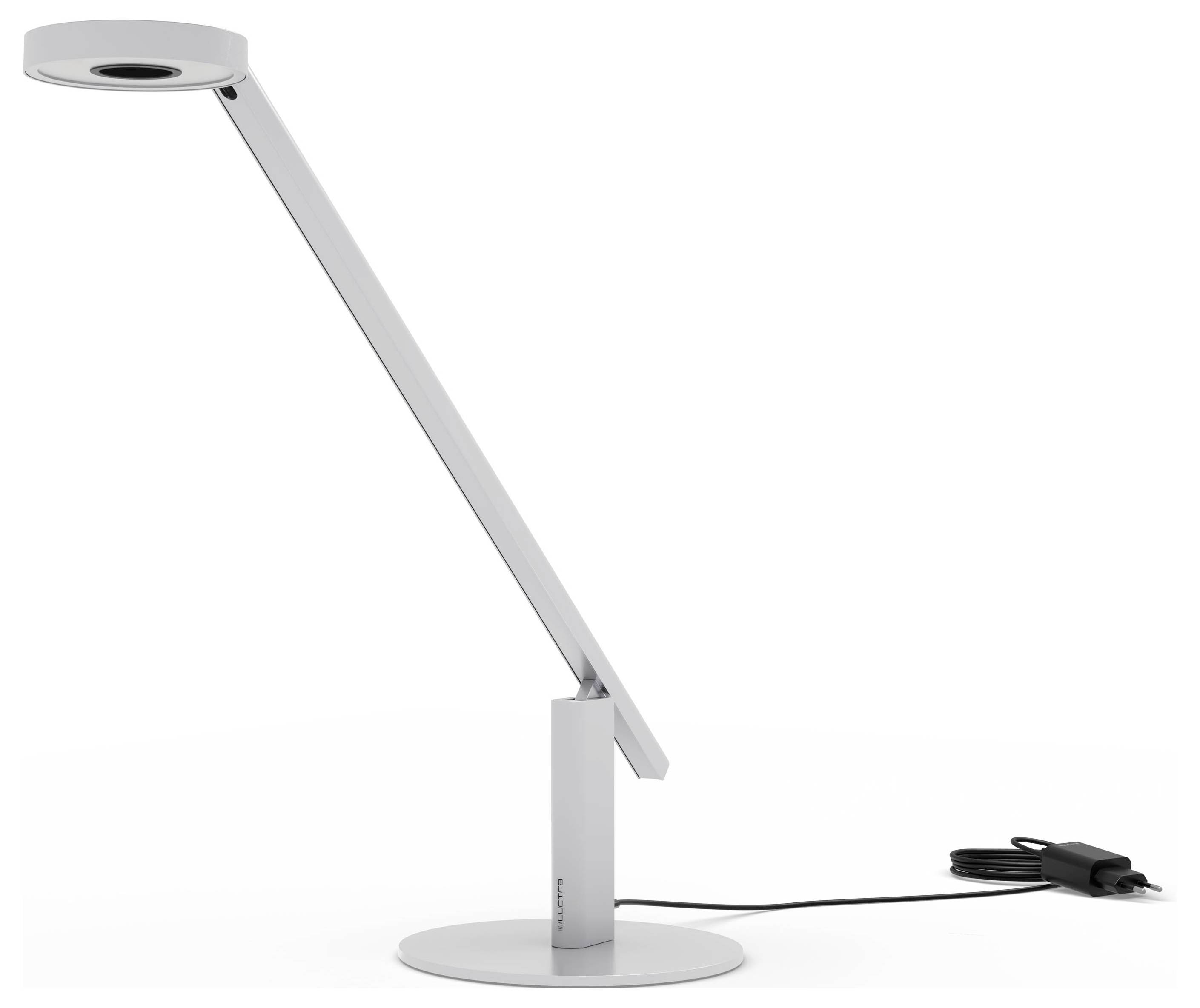 Elegantní moderní stolní lampa s nastavitelným ramenem a kruhovým LED světelným tělem, spočívající na kulatém podstavci, s napájecím kabelem vedeným za ní.