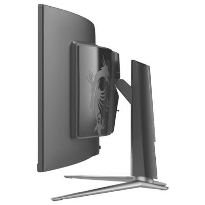Boční pohled na štíhlý, moderní počítačový monitor s designem draka na zadním panelu. Monitor je zakřivený s minimalistickým stojanem.
