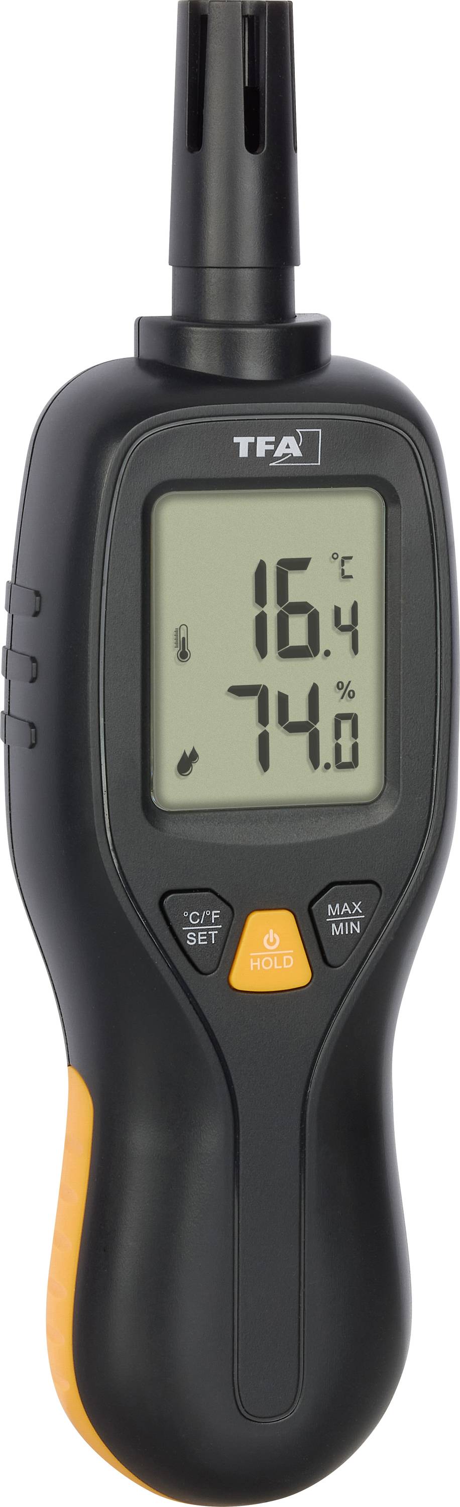 Digitální teploměr zobrazující teplotu 16,4 °C na displeji a vlhkost 74,0 %. Zařízení je černé s oranžovým akcentem.