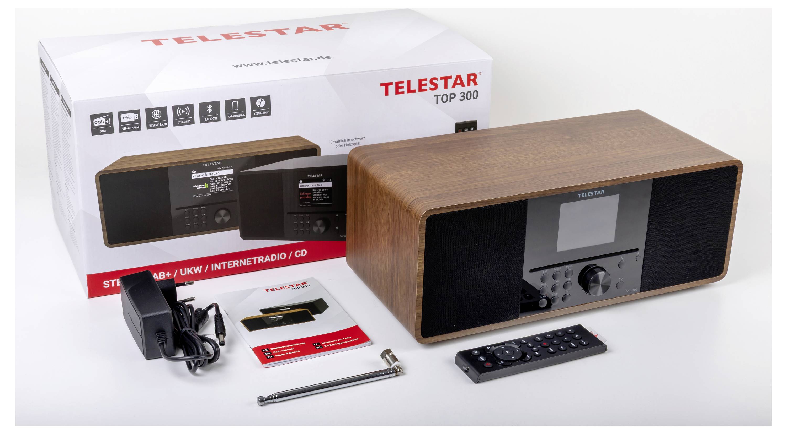 Radiostanice Telestar Top 300 s krabicí, napájecím adaptérem, dálkovým ovladačem, anténou a manuály. Rádio nabízí internetové rádio a CD přehrávač.