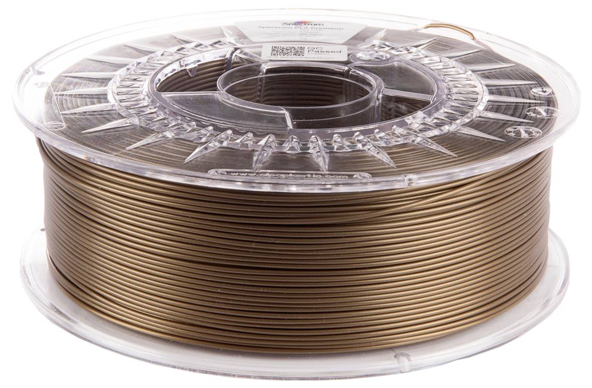 Cívka metalicky hnědého 3D tiskového filamentu, těsně smotaná a umístěná v průhledném plastovém obalu.