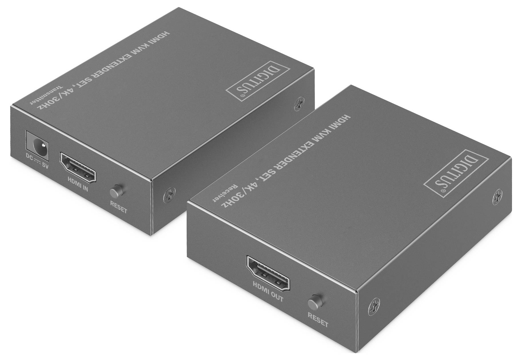 Dva šedé digitální HDMI extendery s porty označenými "HDMI In", "HDMI Out" a "Reset" jsou umístěny vedle sebe.